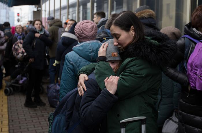 People in Kyiv, Ukraine crowd the train stations trying to get out of the country during the Russian invasion, but the evacuation trains are not enough for all the people. 1 March 2022. Photo: Sebastian Backhaus/Agentur Focus/Redux.